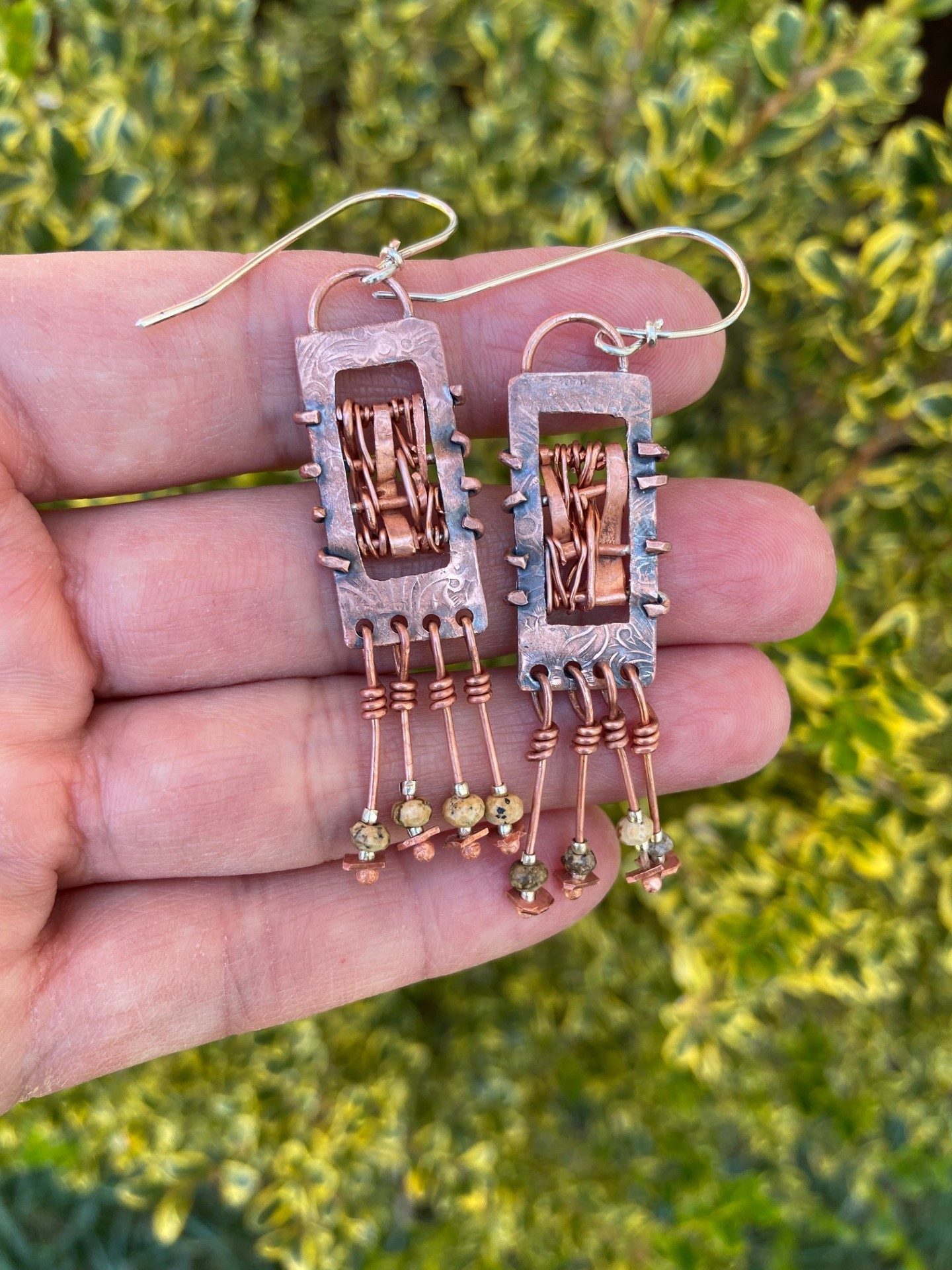 Woven copper earrings with jasper beads