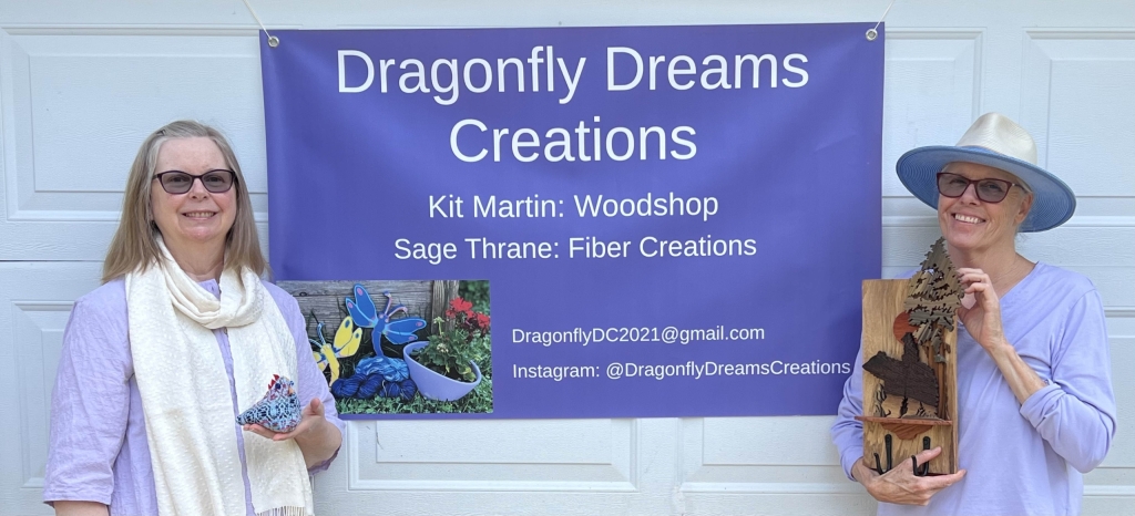 DragonflyDreams2026-1 Two women in front of a banner